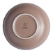 An Ariane Tornado dessert bowl with a brown exterior and white interior and rim.