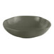 A mist green Ariane Earth porcelain bowl with speckled dots.