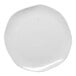 A white Ariane porcelain plate with specks on it.