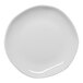 An Ariane Earth white porcelain plate with a curved edge.