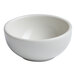A small, round, warm white porcelain bowl.