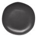 A charcoal grey Ariane Earth porcelain plate with small white dots on a white background.