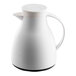 A white plastic coffee carafe with a handle and spout.