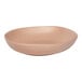 An Ariane Earth porcelain plate with a speckled surface and brown rim.