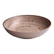 An Ariane Tornado deep coupe porcelain plate with a speckled design on a white background.