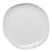 A white Ariane Earth porcelain plate with speckled dots.