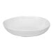 An Ariane Earth white porcelain plate with a deep center.