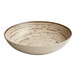 A white Ariane porcelain plate with a brown speckled sand dollar design.