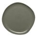 A mist green Ariane Earth porcelain plate with speckled dots.