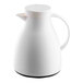 A white plastic coffee carafe with a handle and spout.