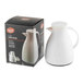 A white plastic coffee carafe with a glass liner, shown next to its packaging box.