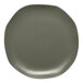 An Ariane mist green porcelain plate with grey dots.