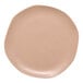 A dark sand Ariane Earth porcelain plate with white dots on a white background.