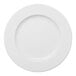 A round, wide-rimmed, warm white porcelain plate.