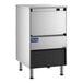 An undercounter air-cooled ice machine with a stainless steel exterior and a front-facing bin.