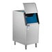 A stainless steel ice storage bin with a top-opening lid and blue interior, designed for commercial use.