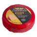 A 7-ounce wheel of Castello Edam cheese wrapped in red wax.