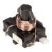 A black and silver electrical relay with a copper coil.