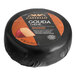 A 7-ounce wheel of Castello smoked Gouda cheese wrapped in black packaging.