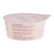 A small container of Cocojune Dairy-Free Strawberry Rhubarb Coconut Cultured Yogurt Alternative.