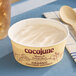 A 4-ounce container of Cocojune organic cultured coconut yogurt alternative in vanilla chamomile flavor.