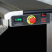 An electric portable back bar with a black laminate and stainless steel finish, featuring a control panel with an emergency stop button and digital display.