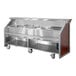 A stainless steel and red maple laminate electric portable bar with a fixed speed rail and two 40 lb. ice bins.