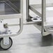 A stainless steel on-board drawbar attachment for utility carts, designed for use with specific Lakeside models.