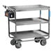 A heavy-duty three-shelf electric utility cart made of metal with large wheels and a control panel on the handle.