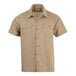 A khaki short sleeve unisex work shirt with two chest pockets and button closure.