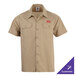 A khaki short sleeve work shirt with two chest pockets and customizable embroidery.
