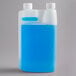 A translucent plastic bottle containing blue liquid milk frother cleaner with two white caps.