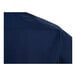 A close-up view of the back shoulder area of a navy blue short sleeve work shirt.
