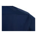 A close-up of the back shoulder area of a navy blue short sleeve women's work shirt.