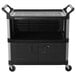 A black Rubbermaid equipment cart with lockable doors.