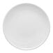 A round, rimless, warm white porcelain coupe plate.