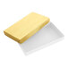 A rectangular two-piece candy box with a gold lid and a white base.