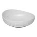 A white, round, slanted porcelain coupe bowl.