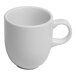 A small, warm white porcelain espresso cup with a handle.