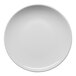 A round, warm white porcelain coupe flat plate with a slightly slanted edge.