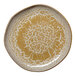 An irregular round porcelain flat plate with a gold and brown speckled pattern.