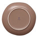 A gold and brown irregular round porcelain flat plate shown from the bottom.