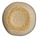 A gold and brown irregular round porcelain deep plate.