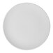 A round, rimless, warm white porcelain coupe plate.