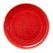 A red round rimless coupe porcelain plate.