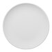 A round, warm white, rimless porcelain coupe plate.