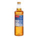 A 1-liter plastic bottle of Torani Mango Flavoring Fruit Syrup.