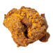 A piece of birria seasoned beef coated with spices.