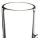 A clear glass coffee mug with a handle.
