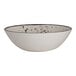 A white melamine round coupe bowl with a speckled interior design.